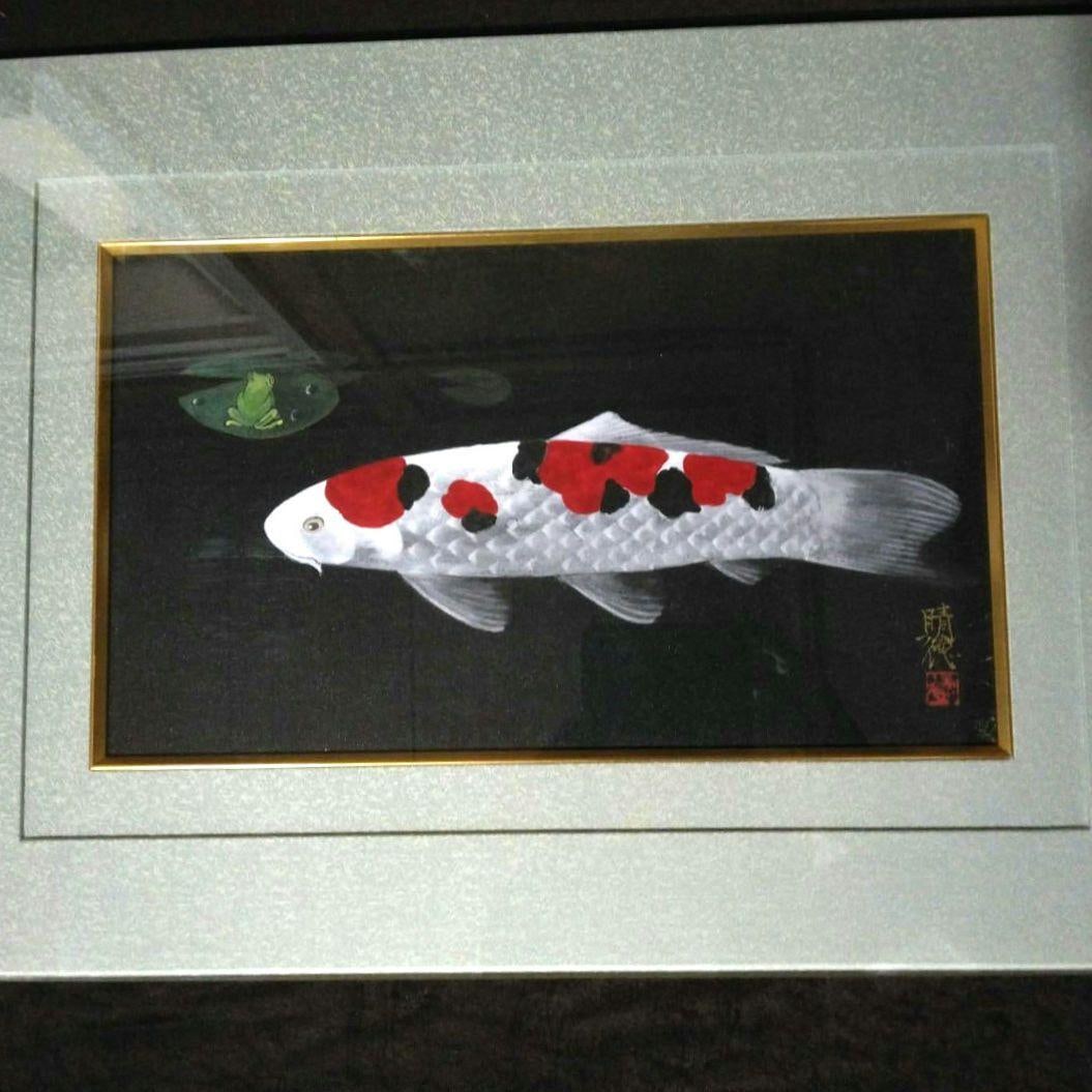 Igarashi Harunori Nihonga Painting of Carp, with Frame and Box: A Japanese painting of a carp and frog by Harunori Igarashi. Artist: Harunori Igarashi Technique/Style: Nihonga Against a black background, a carp in red, white, and black hues creates a beautiful com