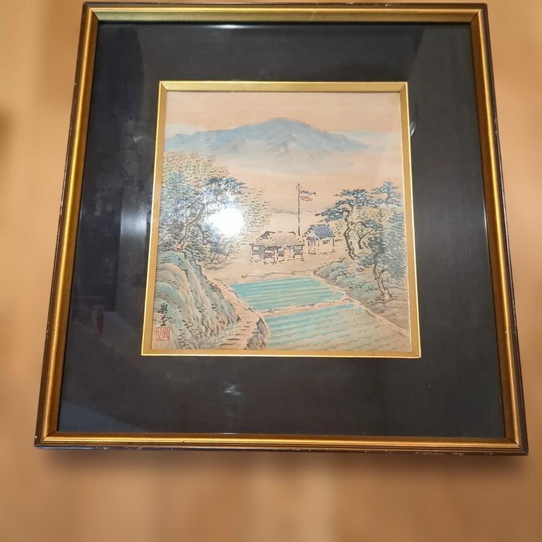 Japanese landscape painting, wooden frame.: A Japanese landscape painting, with soft colors, mounted in a wooden frame. Technique: Nihonga (Japanese painting) Subject: Landscape Color Scheme: Light tones Dimensions: Approximately 30 cm x 25 cm 