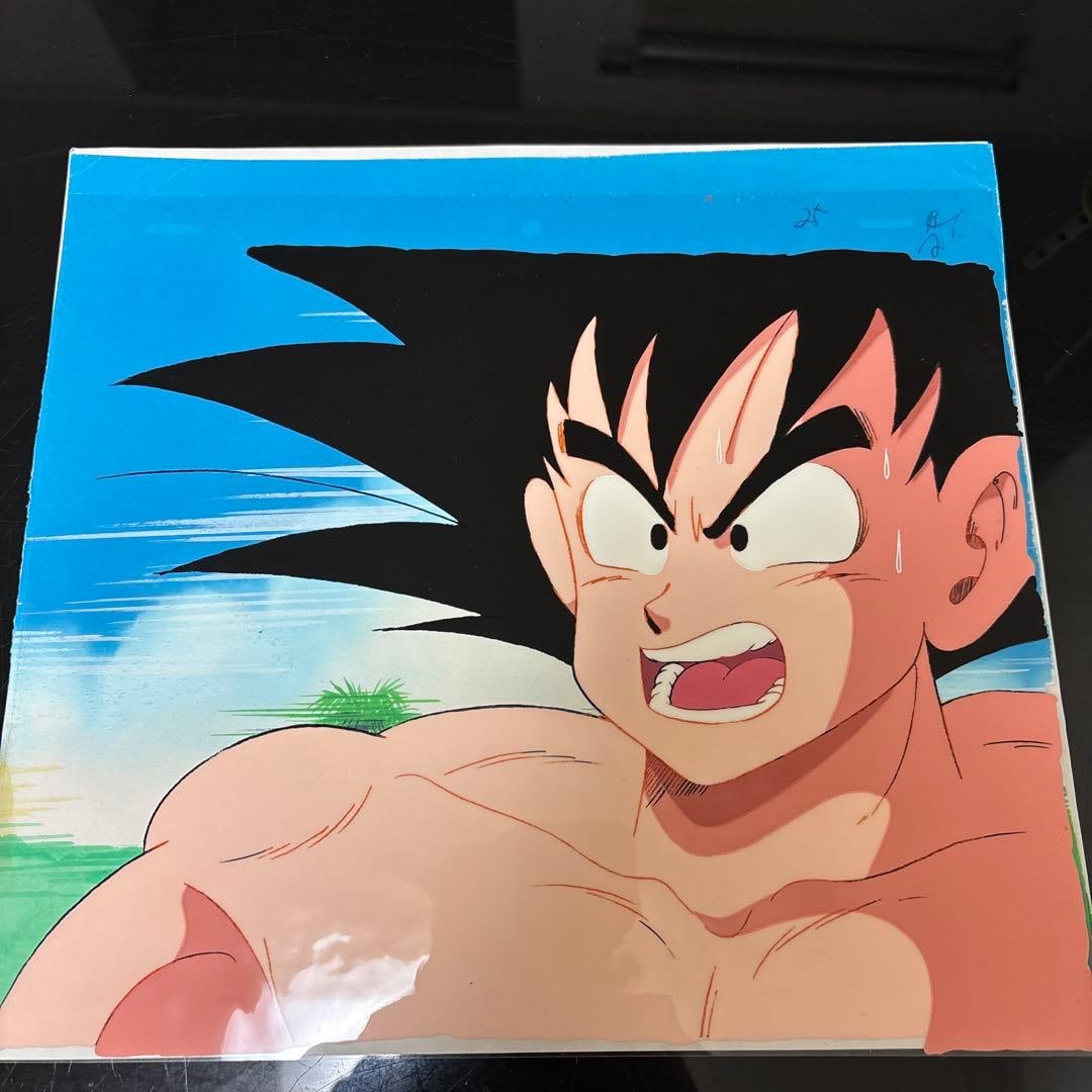 Dragon Ball Son Goku Cel Animation Toei Animation Set: Early Tenkaichi Budokai Scene. Cel Animation and Sketch Set Toei Hand-drawn Goku Animation Art, Rich in Color, Vivid Expression. Character: Goku Art Style: Animation Cel Art Sketch Technique: Hand-dra