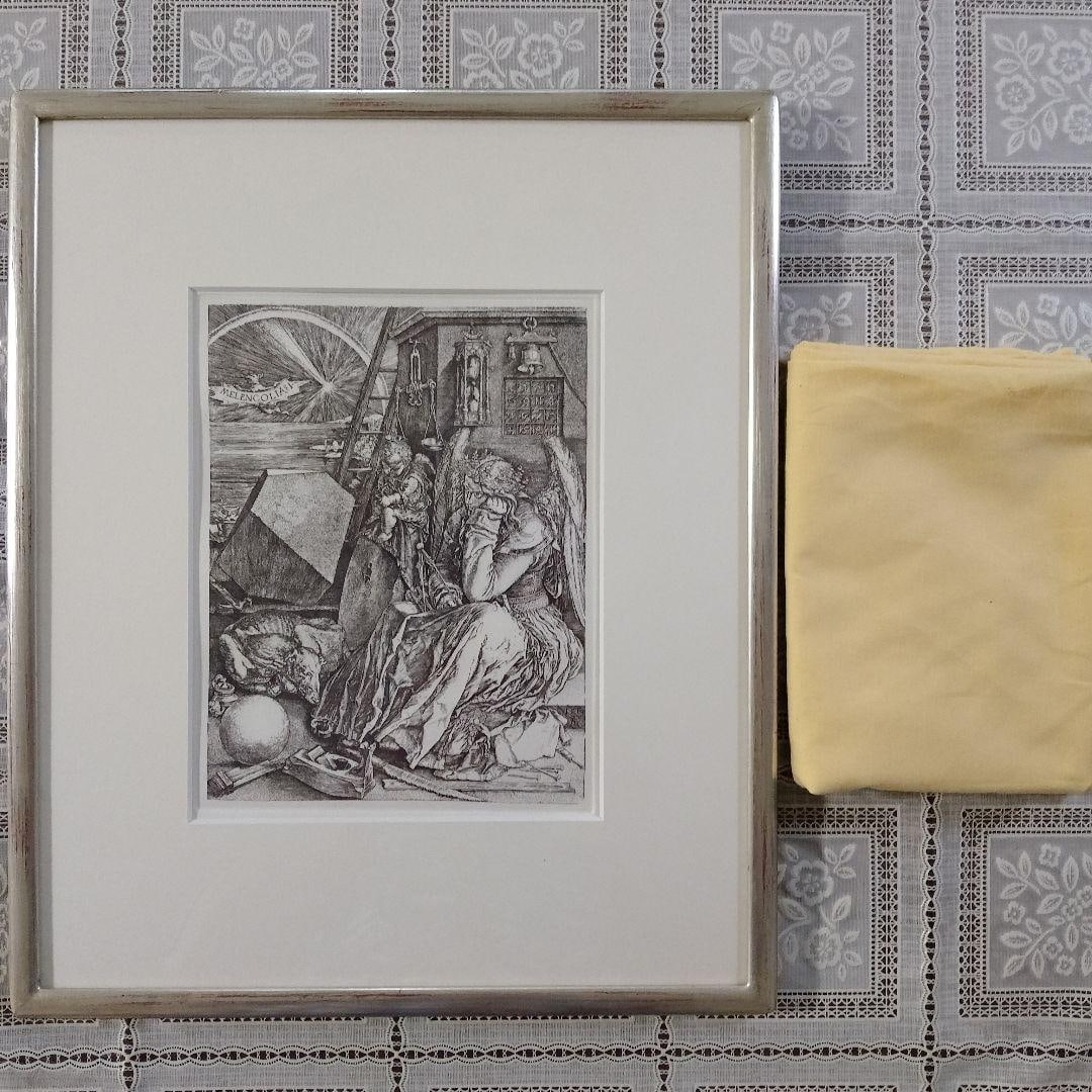 "Unused" Albrecht Durer Copperplate Engraving "Melencolia I" Accompanied by Ginger Yellow Cloth and: Unused Albrecht Durer Copper Engraving "Melencolia I" with Saffron Yellow Cloth and Original Box. Dimensions: Frame 36x44x2cm, Image 20x25cm. This work, along with "Knight, Death, and the Devil" and "