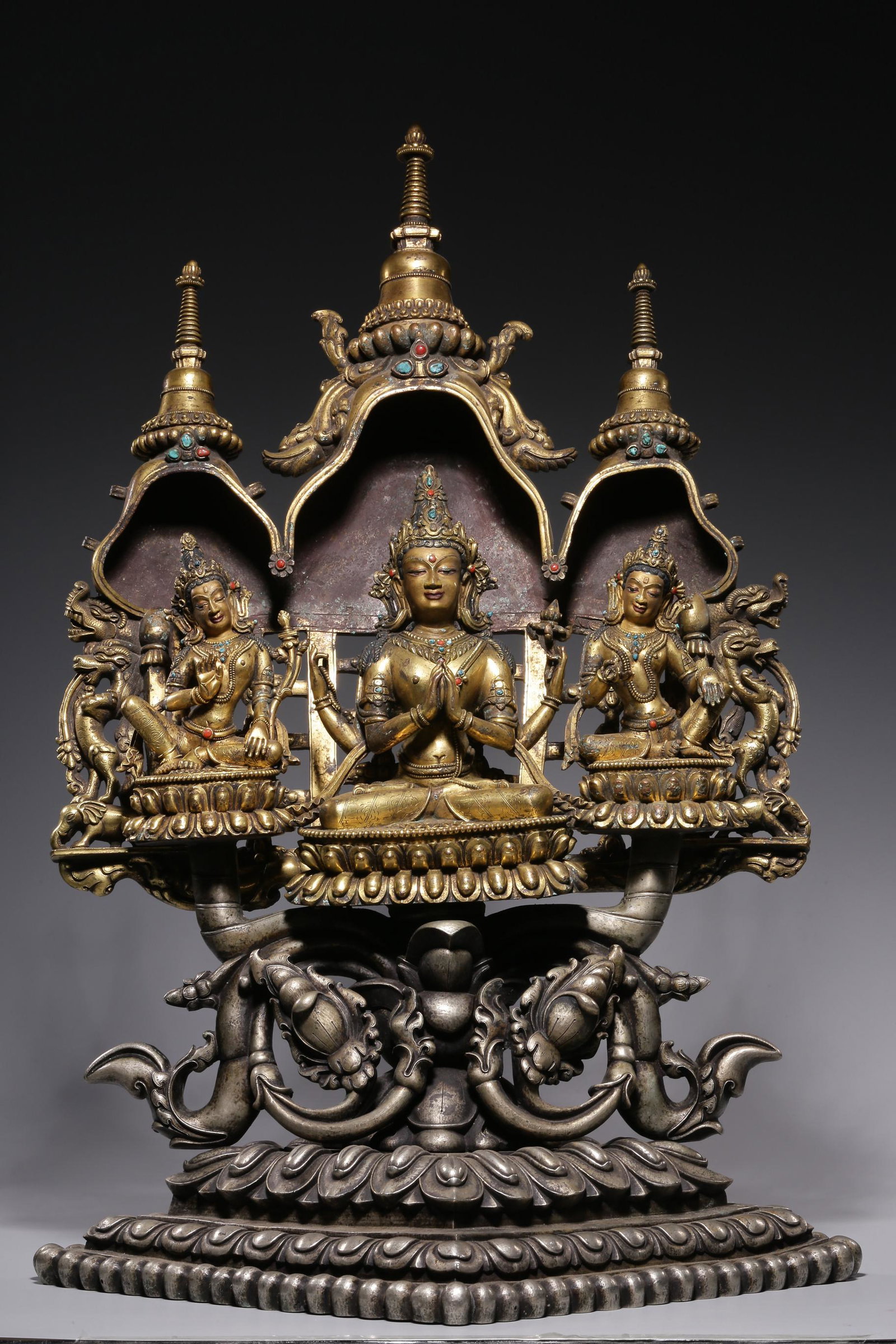 Qing Dynasty, bronze gilt with four arms and three sitting Buddha (1 of 9)