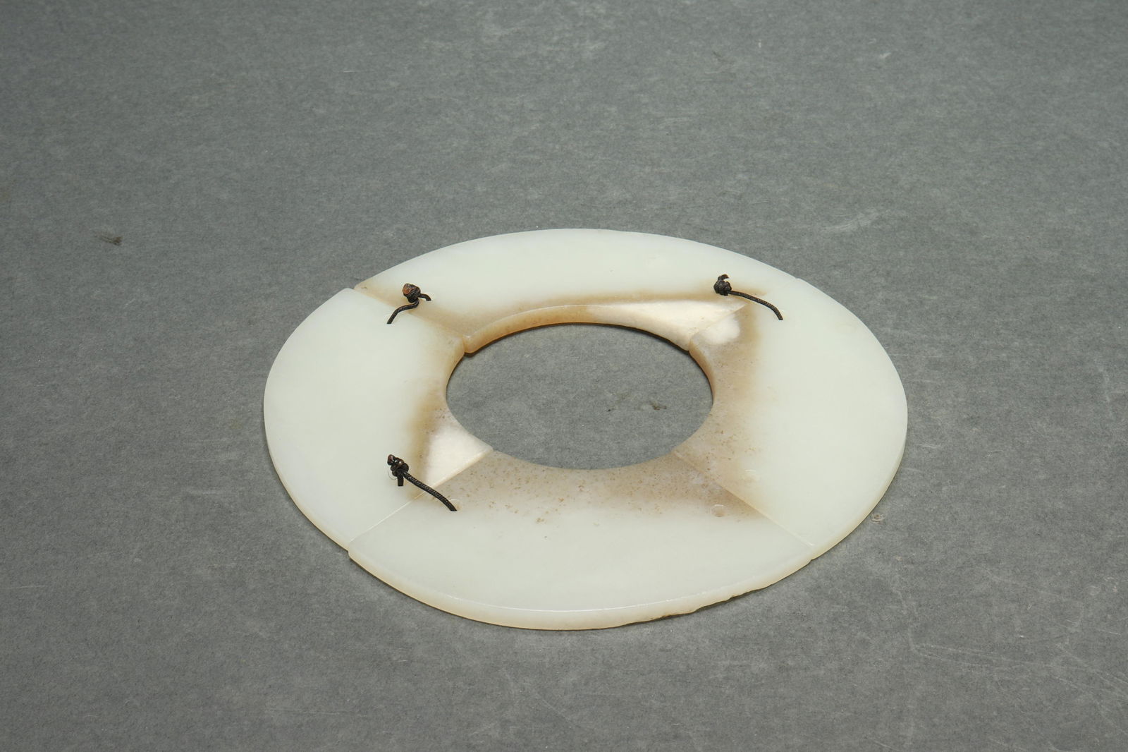 Qi-jia neolithic jade disk made up of 4 pieces (1 of 4)