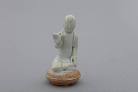 Song Hutian Yingqing blueish ceramic child holding a lotus: H: 2.9 in. (7.5 cm)