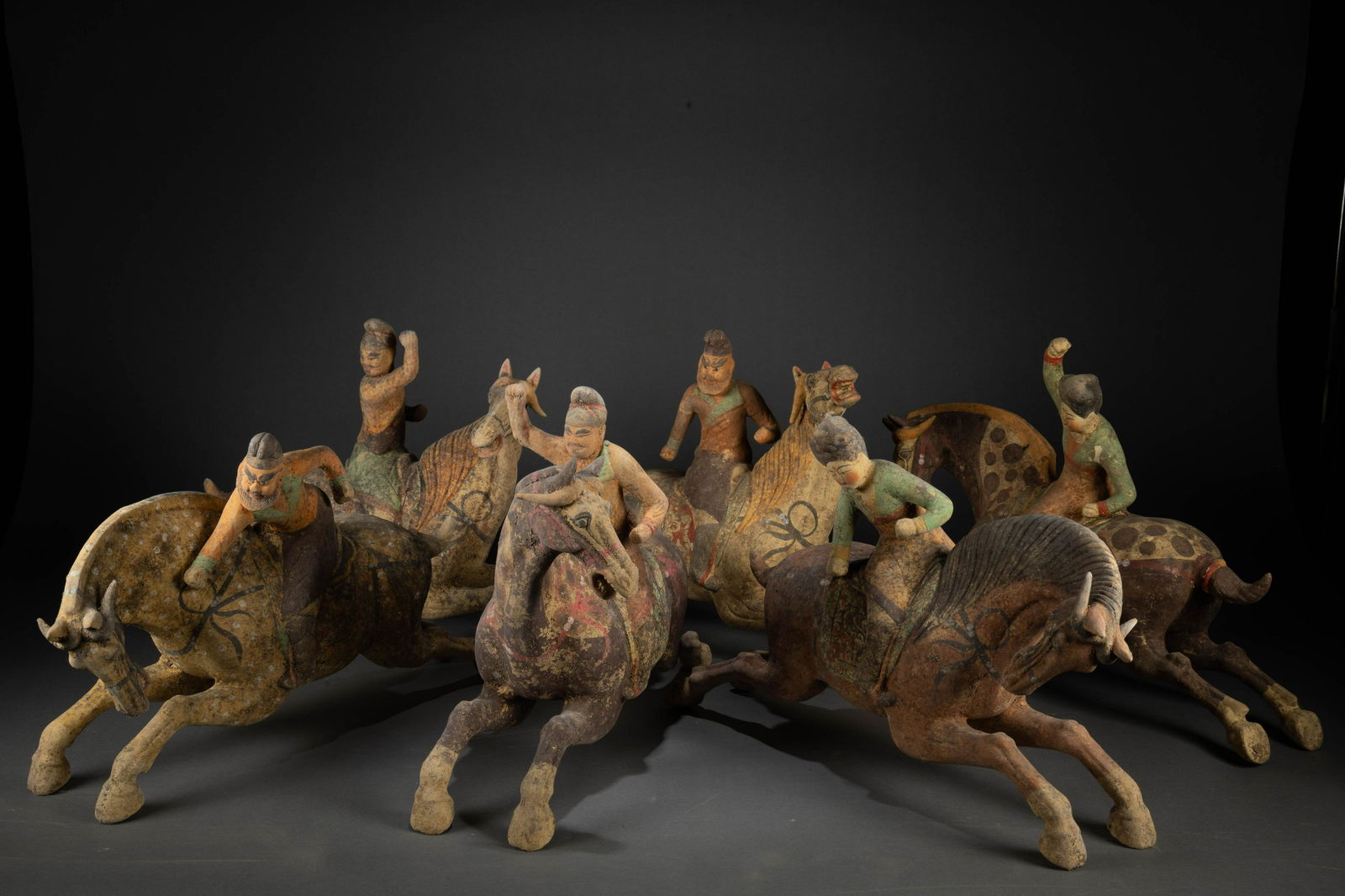 A group of Tang painted pottery polo players (1 of 8)