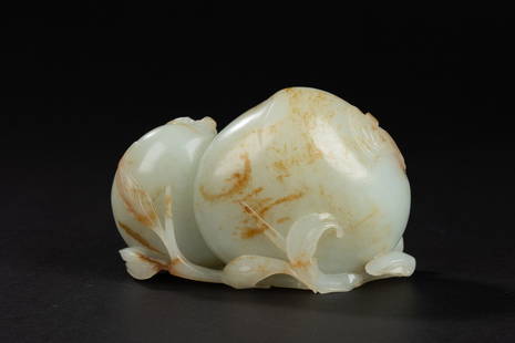 A peach-shaped Hetian jade ornament, Qing dynasty: H: 2.6 in. (6.6 cm) L: 3.7 in. (9.5 cm)