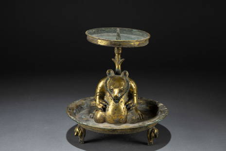 A gliding bear-shaped lamp, Han dynasty: H: 7.5 in. (19 cm) D: 7.5 in. (19 cm)