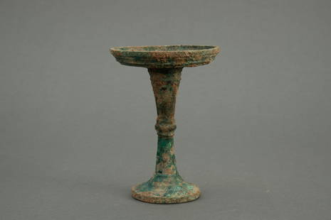 A bronze lamp, Han dynasty: H: 6.1 in. (15.5 cm) D: 4.3 in. (11 cm)