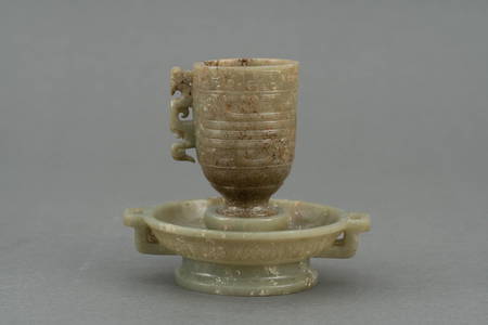 A coiled dragon pattern jade cup, Han dynasty