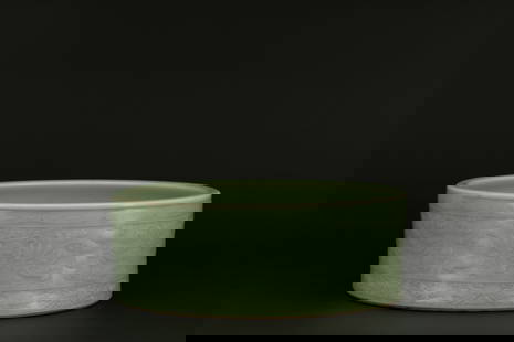 A celadon carved floral pattern brush washer, Ming dynasty, Longquan kiln: H: 4.1 in. (10.5 cm) D: 11.2 in. (28.5 cm)