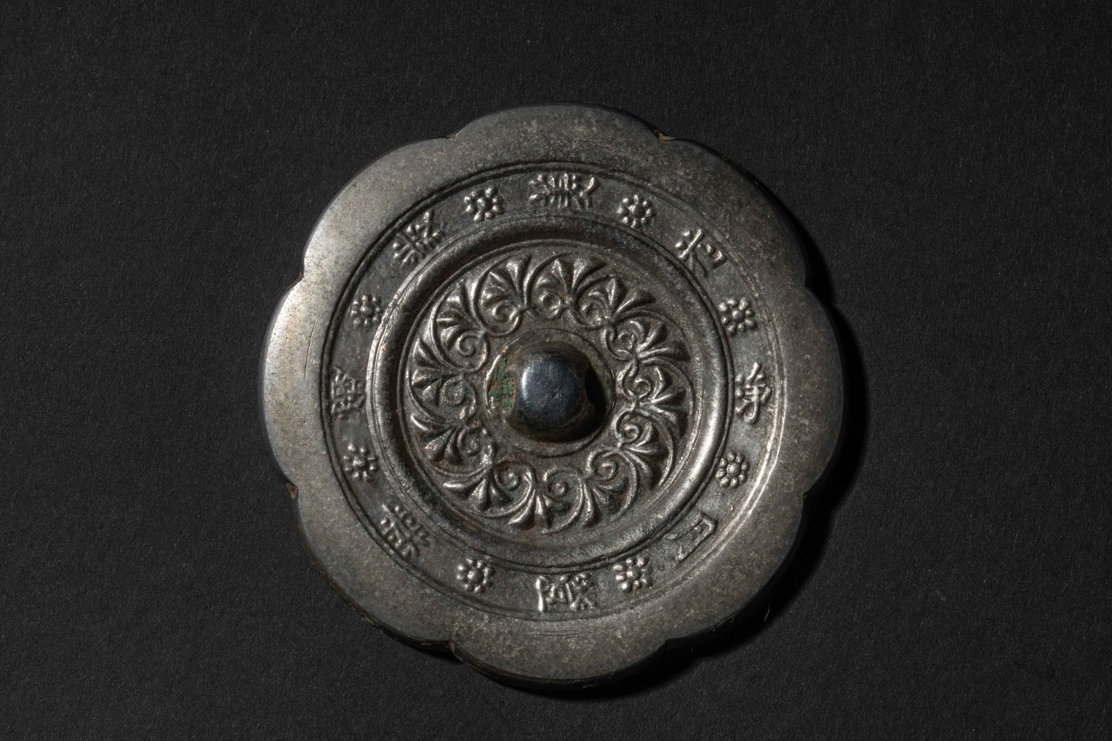 A bronze floral pattern mirror with inscription, Tang dynasty (1 of 5)