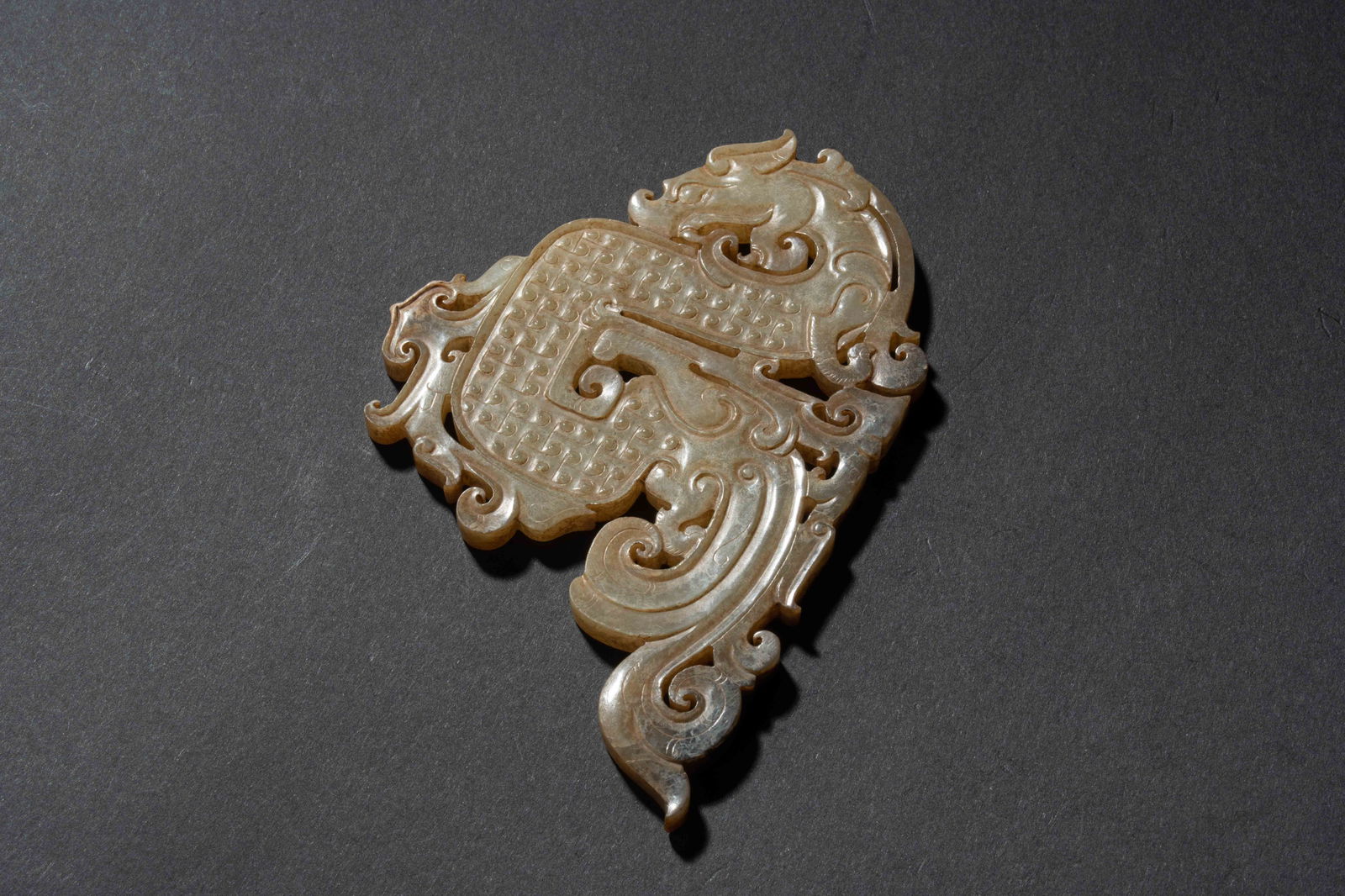 An S-shaped dragon jade pendant, Han dynasty (1 of 5)