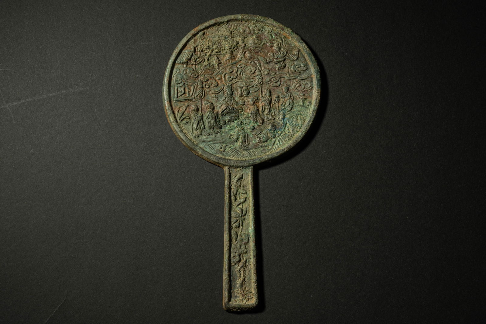 A mirror with a handle, Song dynasty: H: 8 in. (20.5 cm) D: 4.3 in. (11 cm)