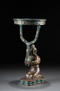 A statue-shaped lamp inlaying with silver and gold, Han dynasty: H: 10.2 in. (26 cm) D: 5.1 in. (13.1 cm)