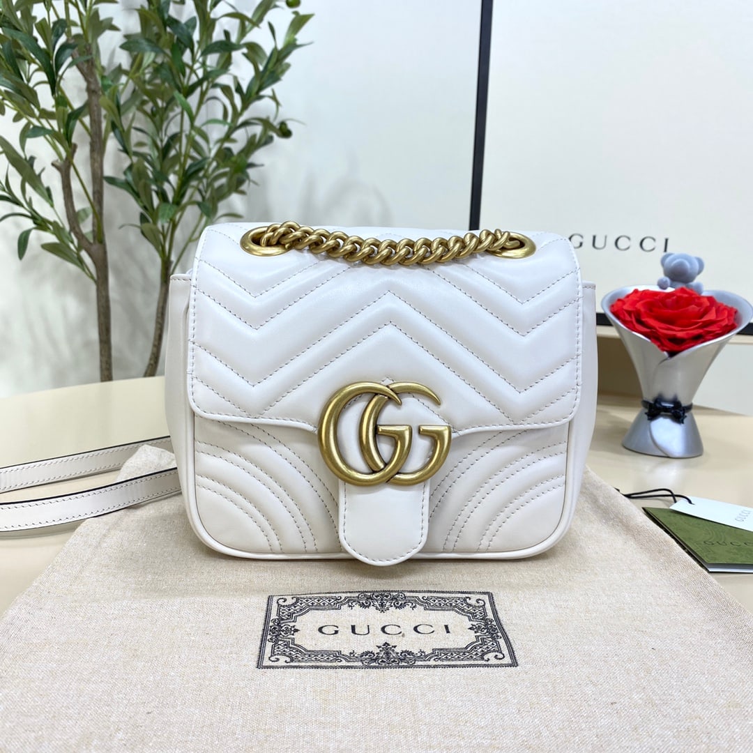 GUCCI MARMONT: The GUCCI Marmont mini white bag, with its highly recognizable quilted fabric and double-G hardware, is a symbol of the GUCCI Marmont handbag collection. This classic collection is released in new sil