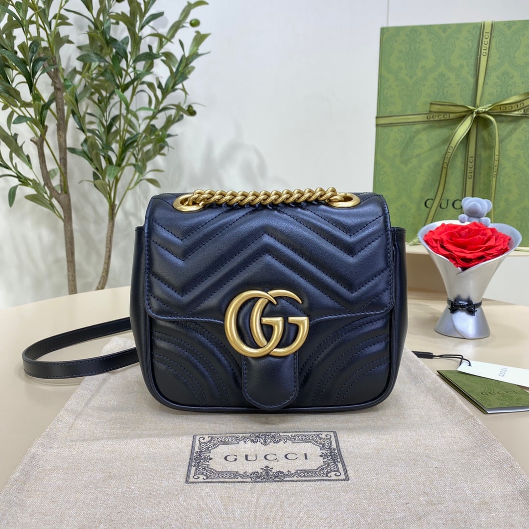 GUCCI MARMONT: The GUCCI Marmont mini black tote bag, with its highly recognizable quilted fabric and double-G hardware, has become an icon of the GUCCI Marmont collection. This classic line is updated each season w