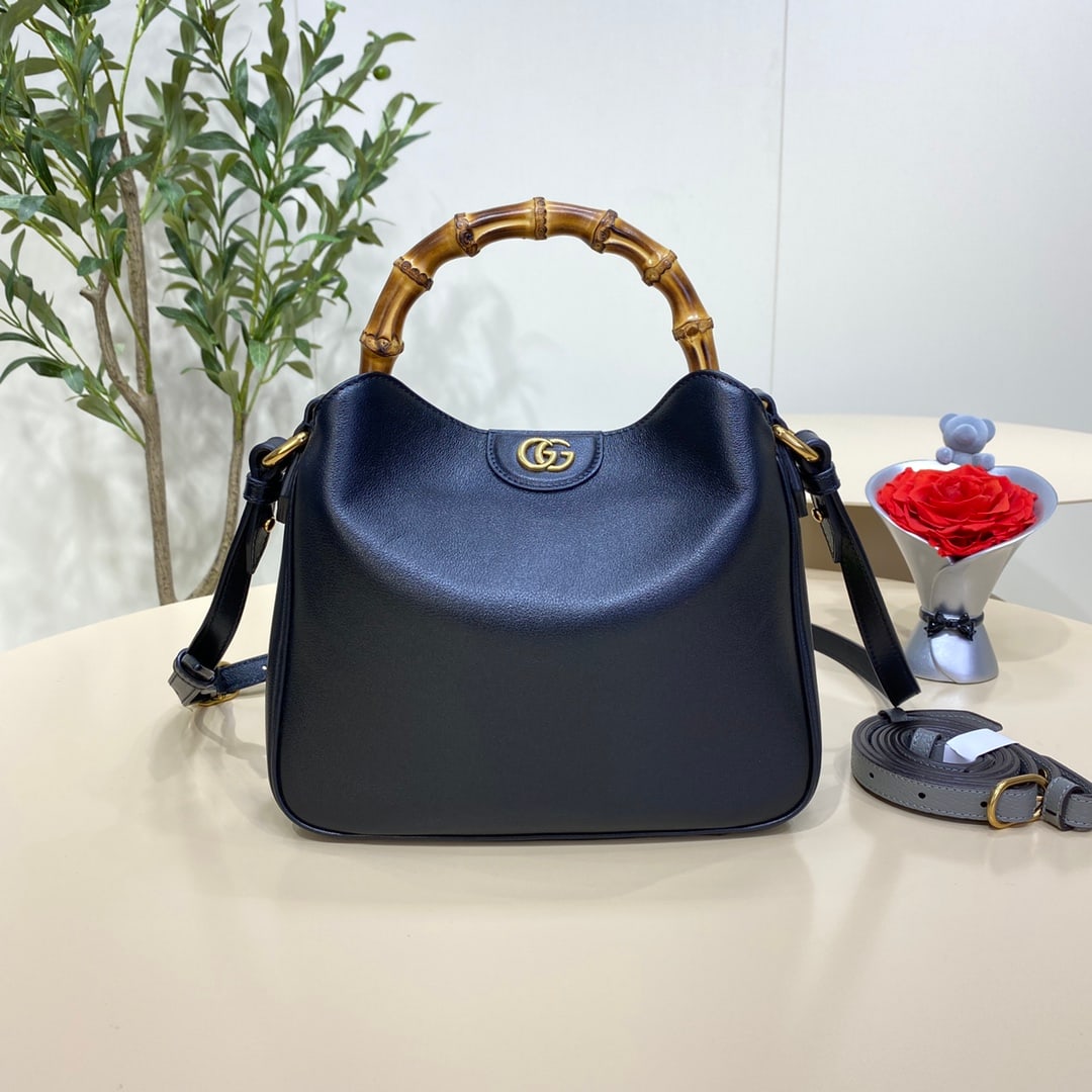 GUCCI Diana: The GUCCI Diana Small Bamboo Bucket Bag in Black cleverly combines two of the brand's most recognizable elements the bamboo handle and the double G hardware giving the entire design a unique charm. Cr