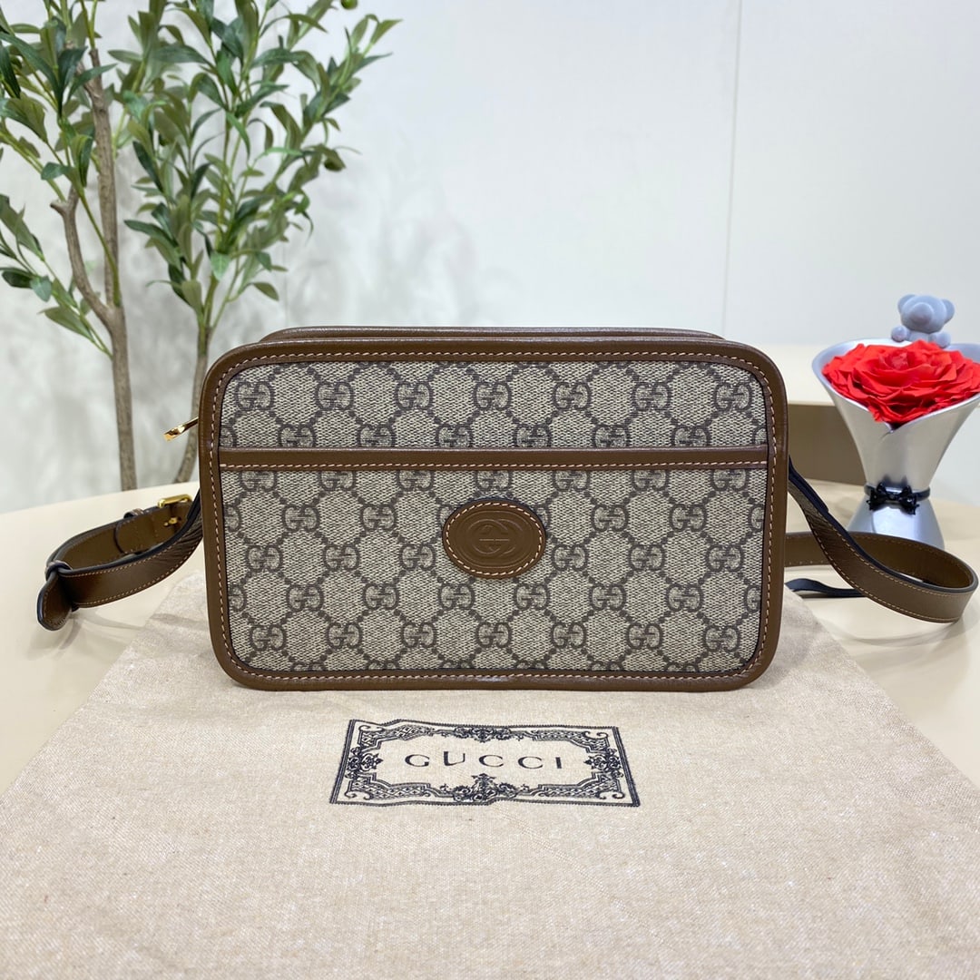 GUCCI Mini Handbag with Interlocking Double G Design: The GUCCI Supreme canvas Mini G G G bag, featuring an interlocking double G design, comes in a classic and timeless combination of ebony and beige. This petite rectangular bag incorporates symbolic el