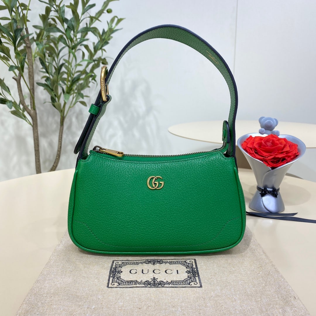 GUCCI Aphrodite: The GUCCI Aphrodite mini shoulder bag in green pays homage to the popular styles of the late 1990s and early 2000s, reinterpreting them with a fresh silhouette. It blends classic design with trendy