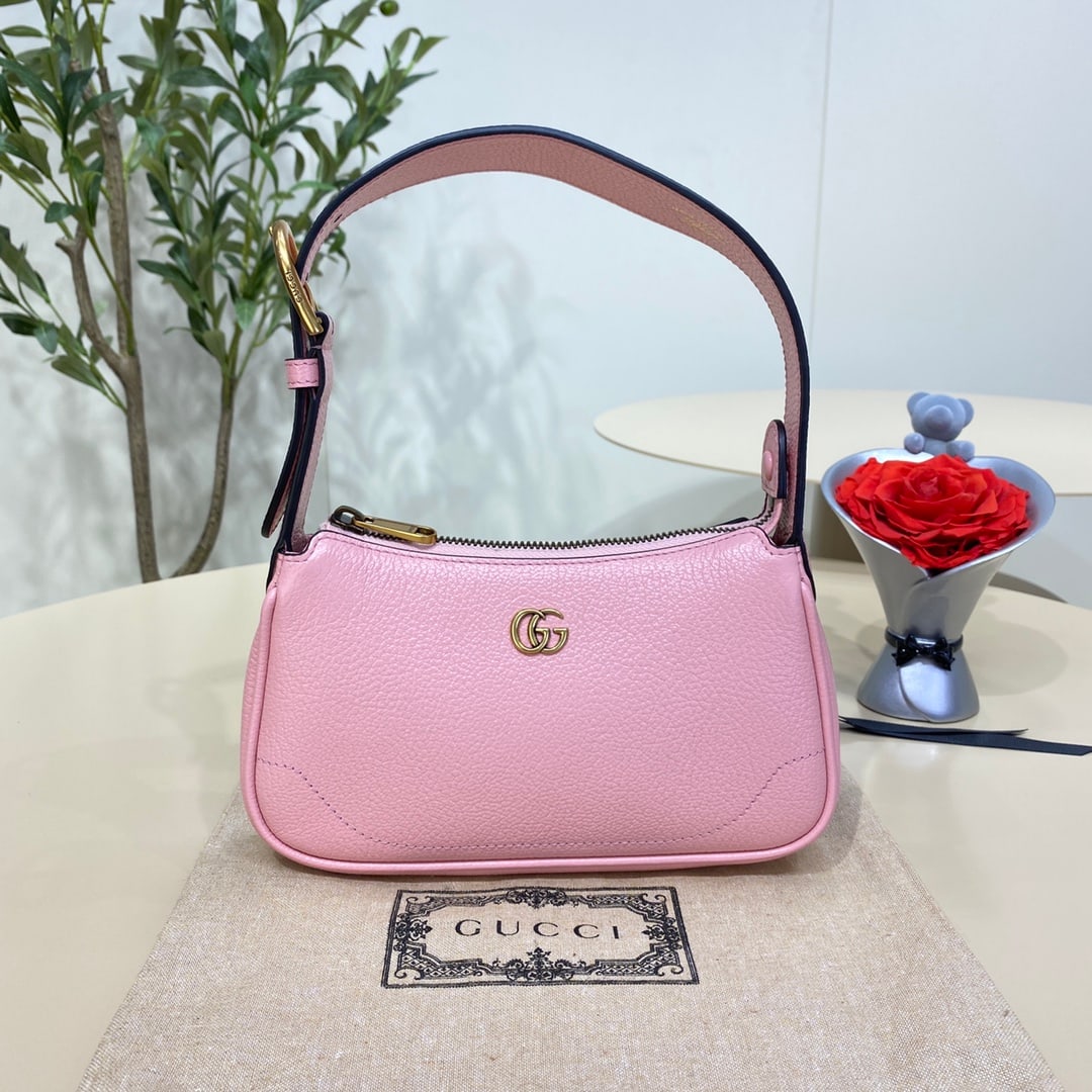 GUCCI Aphrodite: The light pink GUCCI Aphrodite mini shoulder bag pays homage to the popular styles of the late 1990s and early 2000s, reinterpreting them with a fresh silhouette. It blends classic design with trendy 