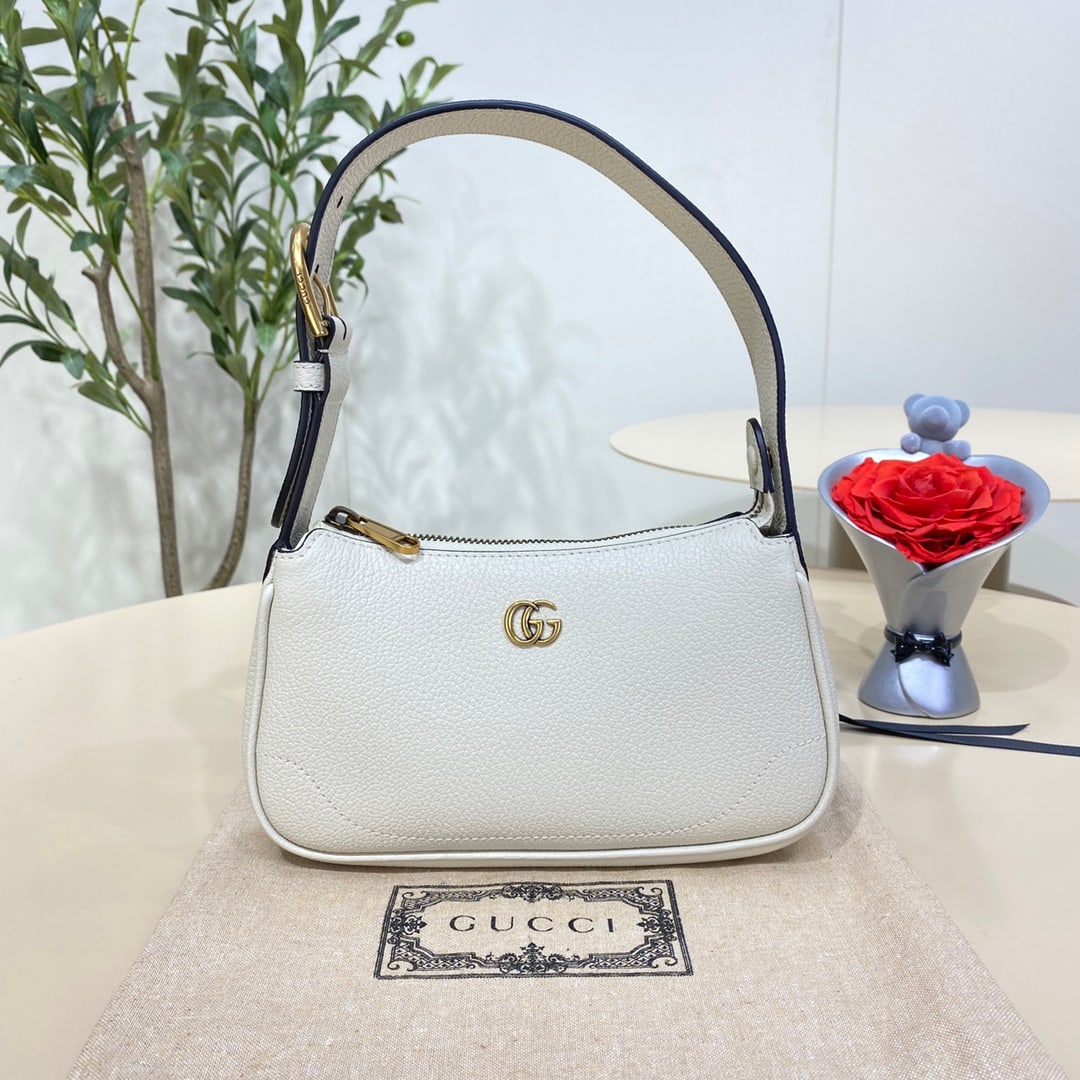 GUCCI Aphrodite: The white GUCCI Aphrodite mini shoulder bag pays homage to the popular styles of the late 1990s and early 2000s, reinterpreting them with a fresh silhouette. It blends classic design with trendy