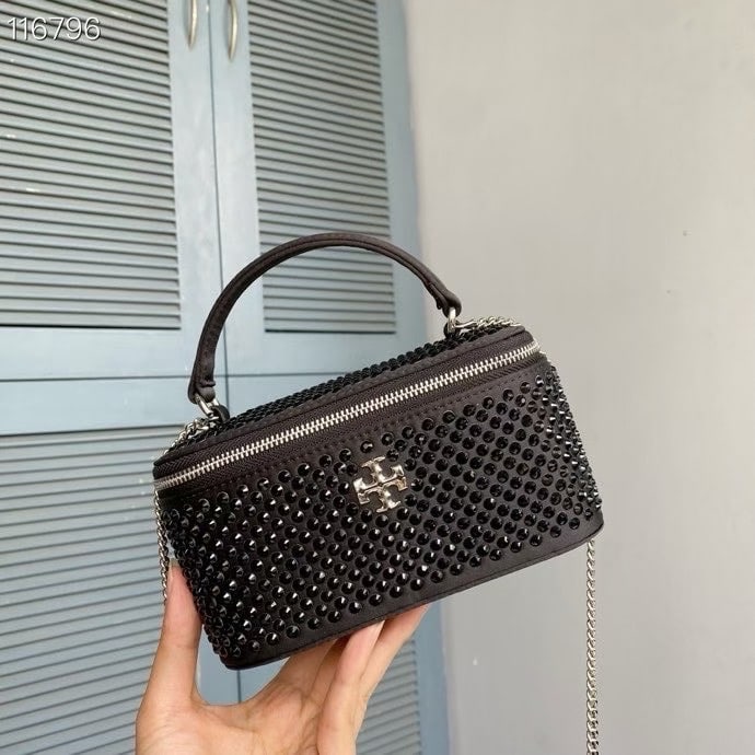 TB Kira: TB Kira Mini Makeup Handbag, Sparkling Night Rhinestone Chain Bag. Features sparkling rhinestone embellishments and a slanted double-T logo trim. Can be carried by the top handle or worn over the
