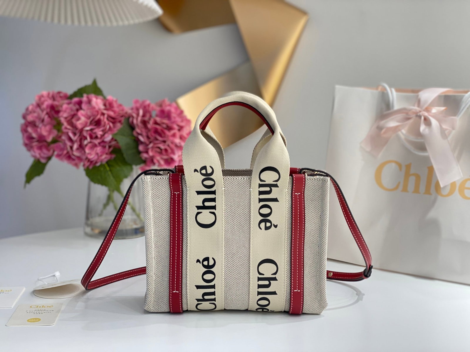 Chloe Woody: The Chloe Woody (smoky red) Tote Bag has generated a lot of buzz on social media. Beautifully designed and spacious, it's a wonderful gift for you or your loved one. We offer consoiled shipping for al