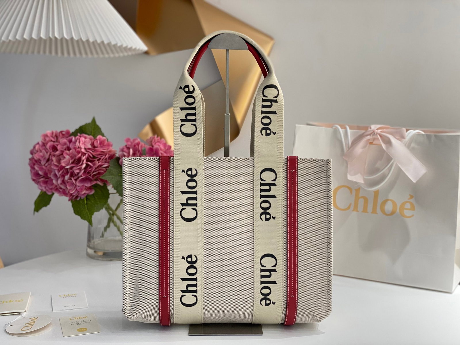 Chloe Woody: The Chloe Woody (smoky red) Tote Bag has generated a lot of buzz on social media. Beautifully designed and spacious, it's a wonderful gift for you or your loved one. We offer consoiled shipping for al