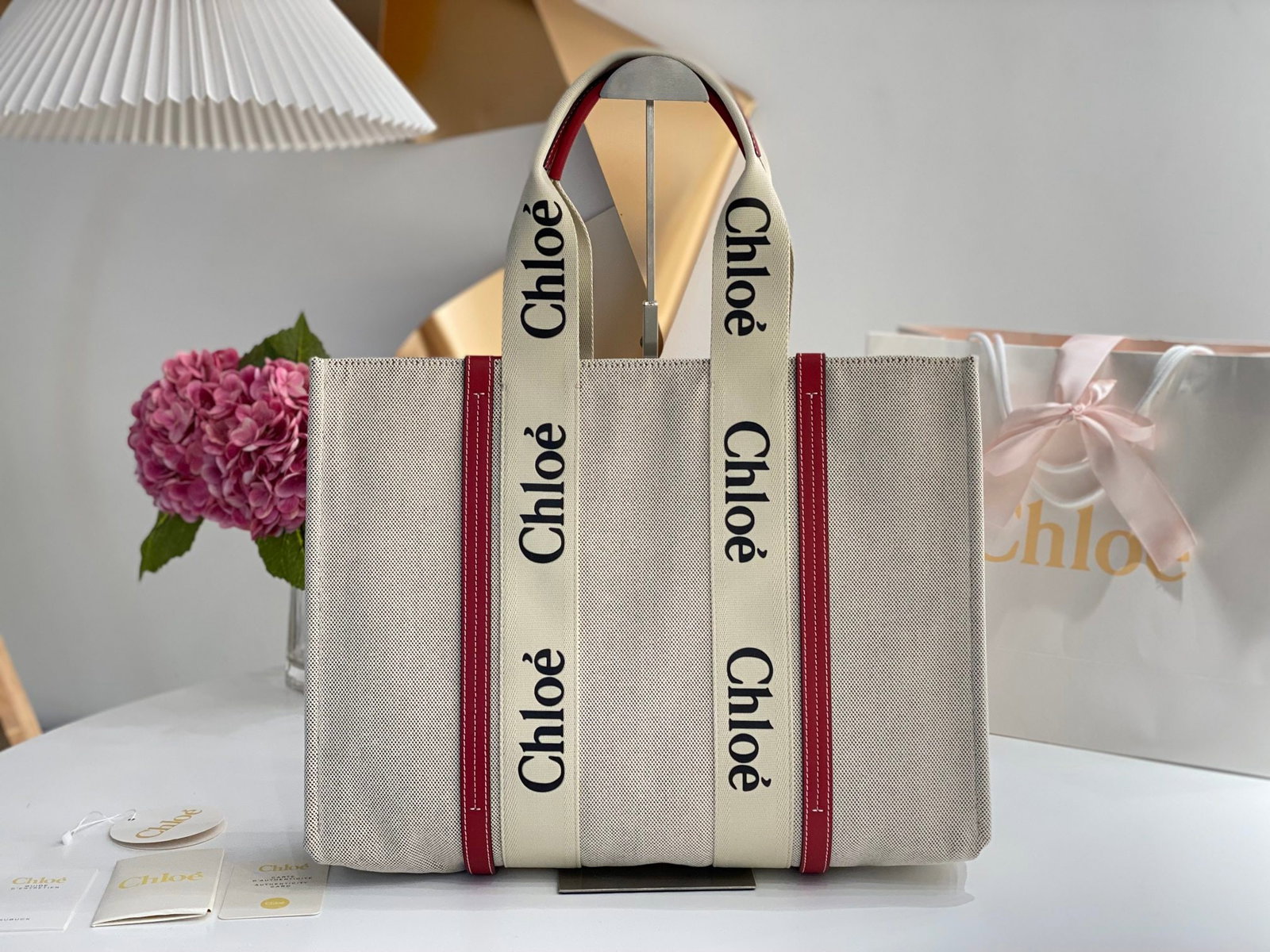 Chloe Woody: The Chloe Woody (smoky red) Tote Bag has generated a lot of buzz on social media. Beautifully designed and spacious, it's a wonderful gift for you or your loved one. We offer consoiled shipping for al