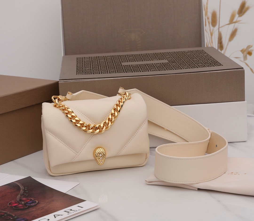 Bvlgari Serpenti Cabochon: The Bvlgari Serpenti Cabochon mini crossbody bag features a captivating oversized graphic pattern and bold metallic details. The ivory-opal white calfskin body is exceptionally soft and smooth. The Se