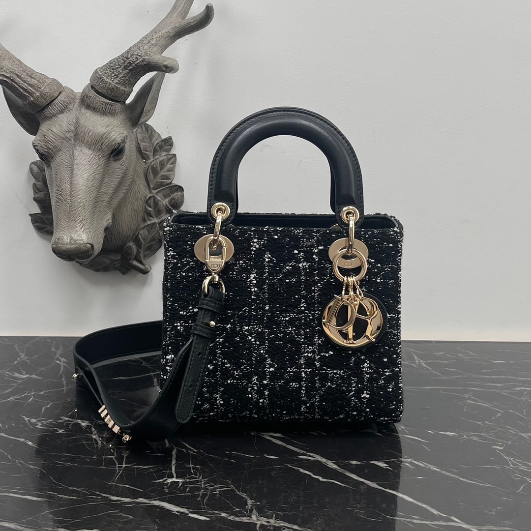Lady Dior: The Lady Dior is crafted from black tweed-effect fabric, adorned with a cannage pattern created using various embroidered threads to elevate its style. A light gold-finished DIOR charm adds a touch of