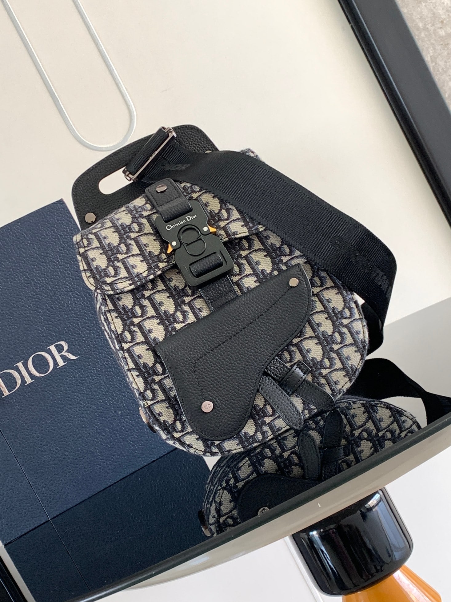 Christian Dior Gallop: The Gallop shoulder bag is a stylish and chic piece that embodies the classic saddle logo. Crafted from beige and black Oblique printed fabric with black grained calfskin details, it features a main c
