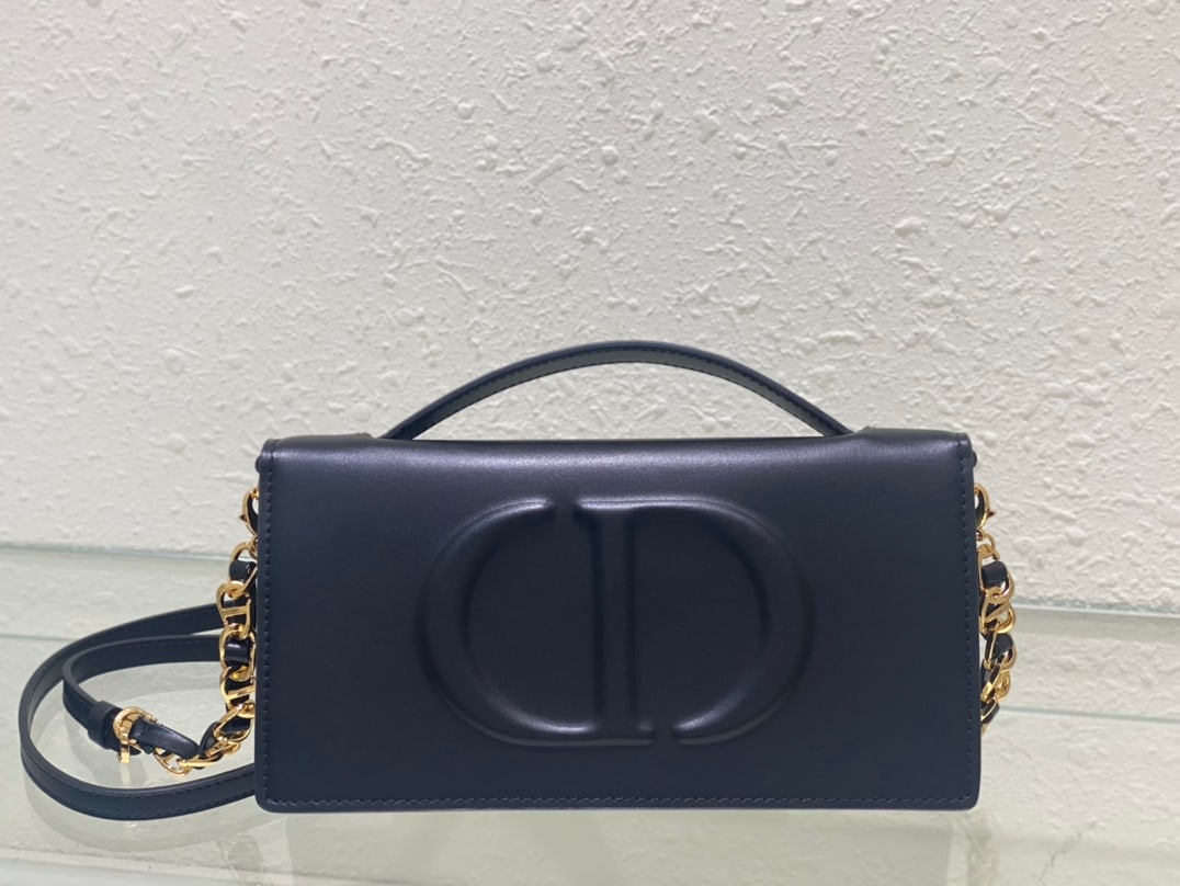 CD SIGNATURE Mini Chain Handbag: The CD Signature Mini Chain Handbag is part of the Fall Winter 2023 ready-to-wear collection, designed by Maria Grazia Chiuri. It blends practical design with Dior's modern spirit. Crafted from black 