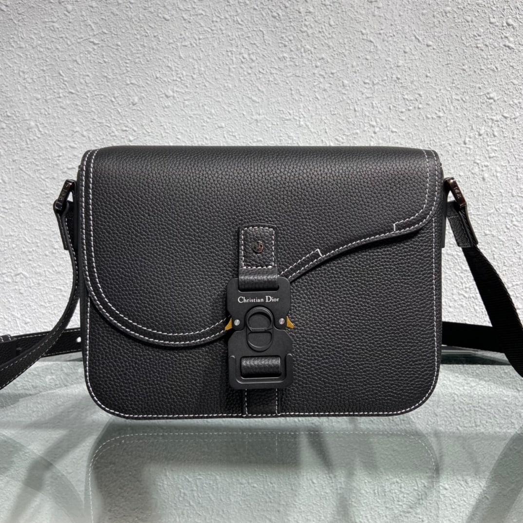 Christian Dior: Dior calfskin crossbody bag. Crafted from black grained calfskin, this bag features a flap closure with an aluminum clasp for added style, adorned with the Christian Dior logo. A compartment provides 