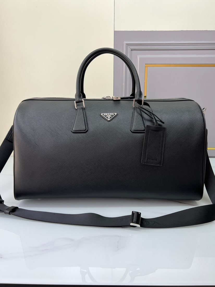 PRADA travel bag: This elegant travel bag is crafted from Saffiano leather, featuring a wraparound zipper and nylon shoulder strap, showcasing a meticulous design philosophy. It's adorned with a leather nameplate and a