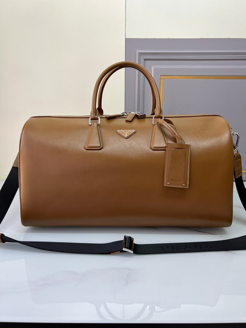 PRADA travel bag: This elegant travel bag is crafted from Saffiano leather, featuring a wraparound zipper and nylon shoulder strap, showcasing a meticulous design philosophy. It's adorned with a leather nameplate and a
