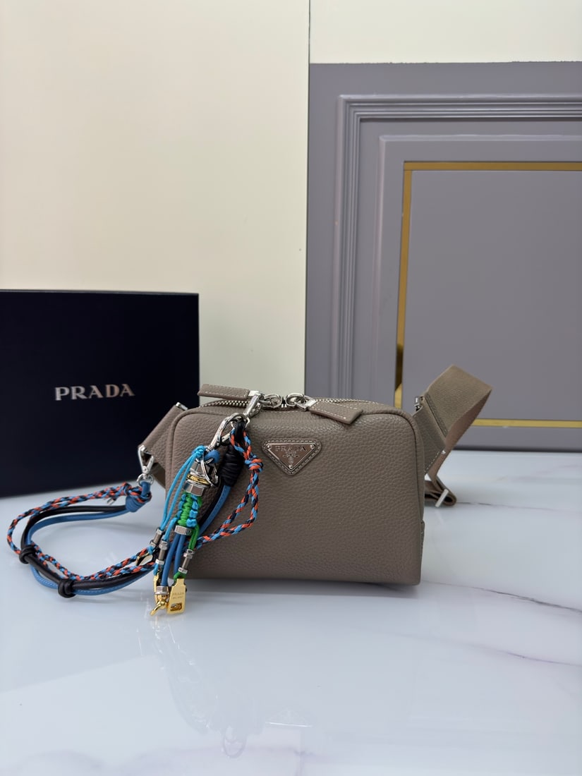 PRADA chest bag: This leather chest bag shoulder bag features a stylish, flowing design and a layered silhouette. The adjustable webbing is made of imported deerskin and cowhide leather. It offers a comfortable and lu