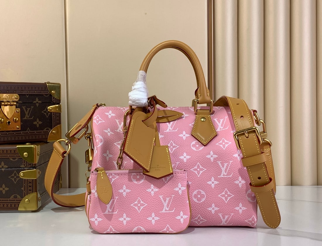 LV Speedy P9 Bandouliere 25: The pink Speedy P9 BandouliEre25 Monogram leather handbag exudes luxury with its supple cowhide leather. The Monogram element is featured on the Monogram printed canvas. The polished, lambskin lining 