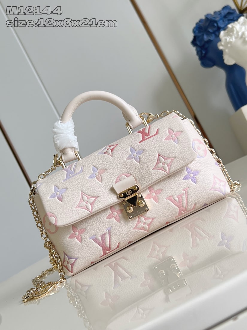 LV Nano Madeleine: The Nano Madeleine handbag features a colorful gradient, radiating dreamy hues for the new season and effortlessly adding a touch of elegance to any look. The classic Monogram Empreinte leather body i