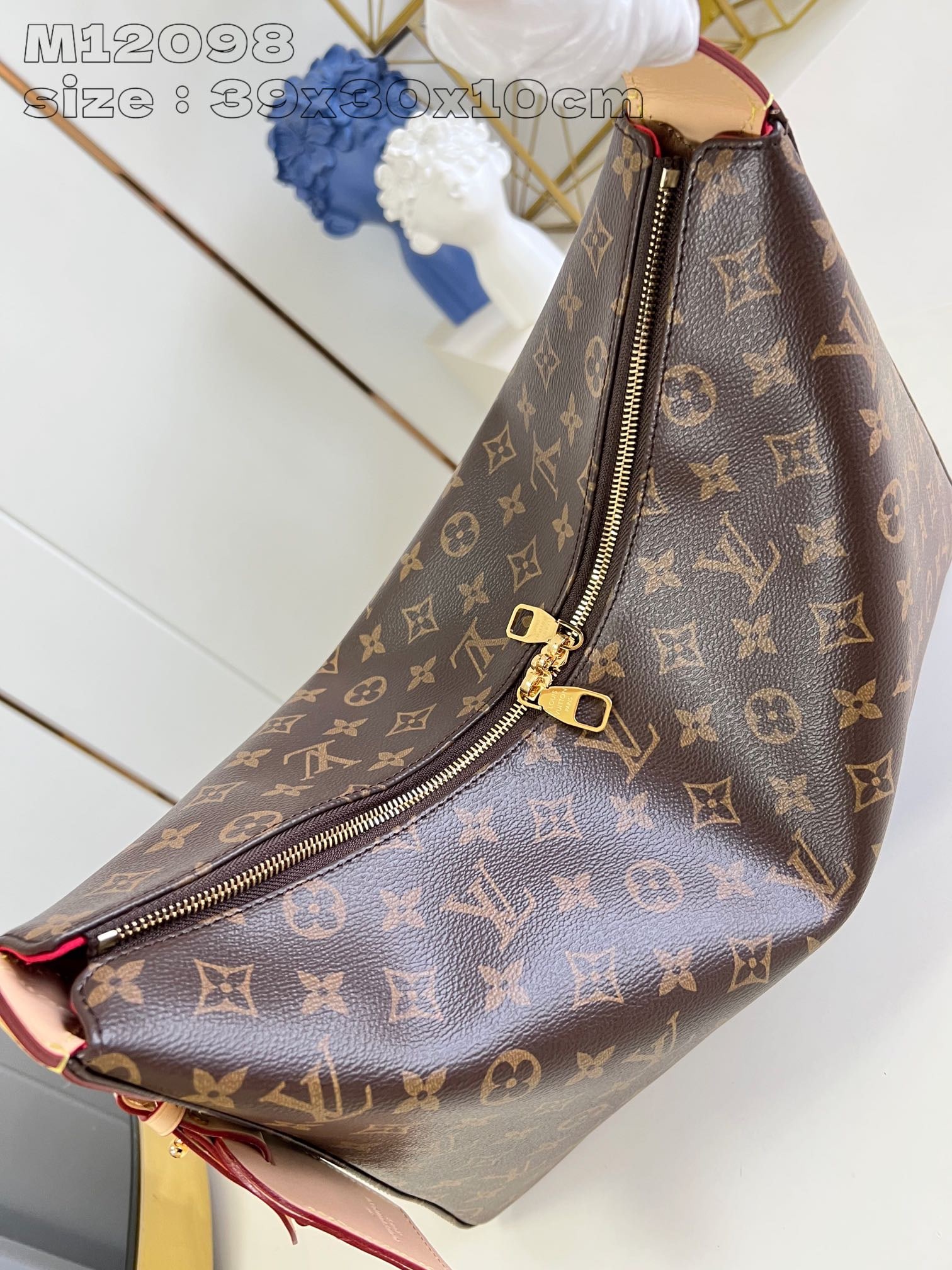 LV Slouchy MM: The Slouchy MM handbag is crafted from Monogram canvas and leather trim, with gold-tone hardware, and includes a new signature padlock name tag. It offers ample space inside for work-to-weekend essent