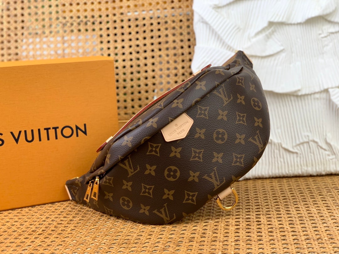 LV BUMBAG: This diamond-patterned BUMBAG waist bag is crafted from classic Monogram canvas and adorned with a "Louis Vuitton Paris" leather patch. It adds a touch of effortless chic to any sporty look. It can be