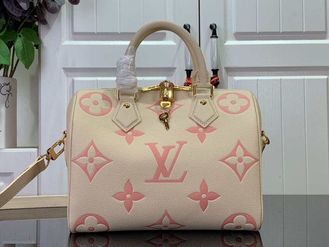 LV Speedy BandouliEre: The Speedy BandouliEre 25 handbag, a striking reappearance in the 2021 Fall Wild at Heart capsule collection, features an oversized LV logo embossed on Monogram Empreinte leather and a detachable shou