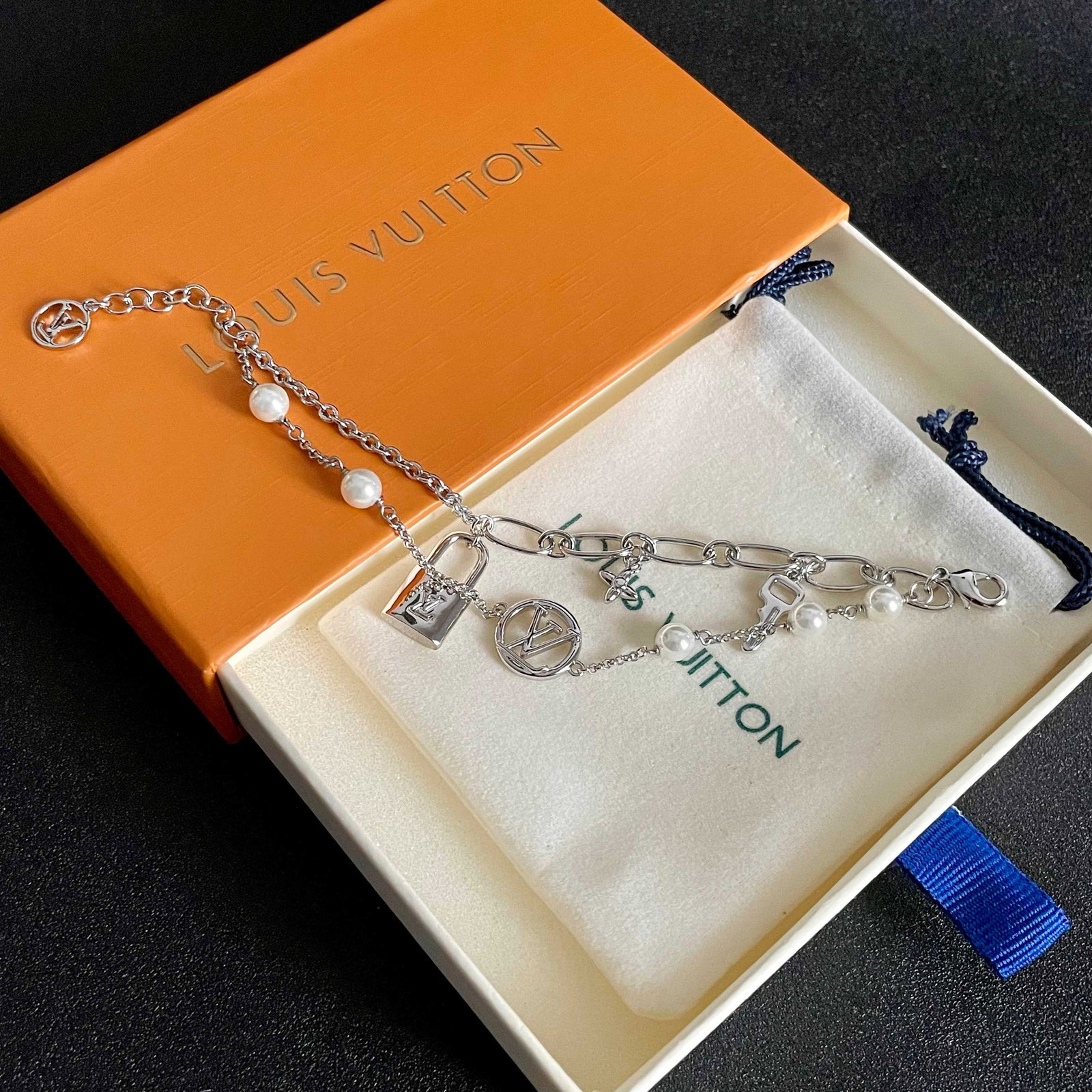 LV bracelet: Louis Vuitton LV bracelet. A must-have for stylish men and women, perfect for a retro yet modern look. A wonderful gift for you or your loved one. We offer consoiled shipping for all goods to our dome