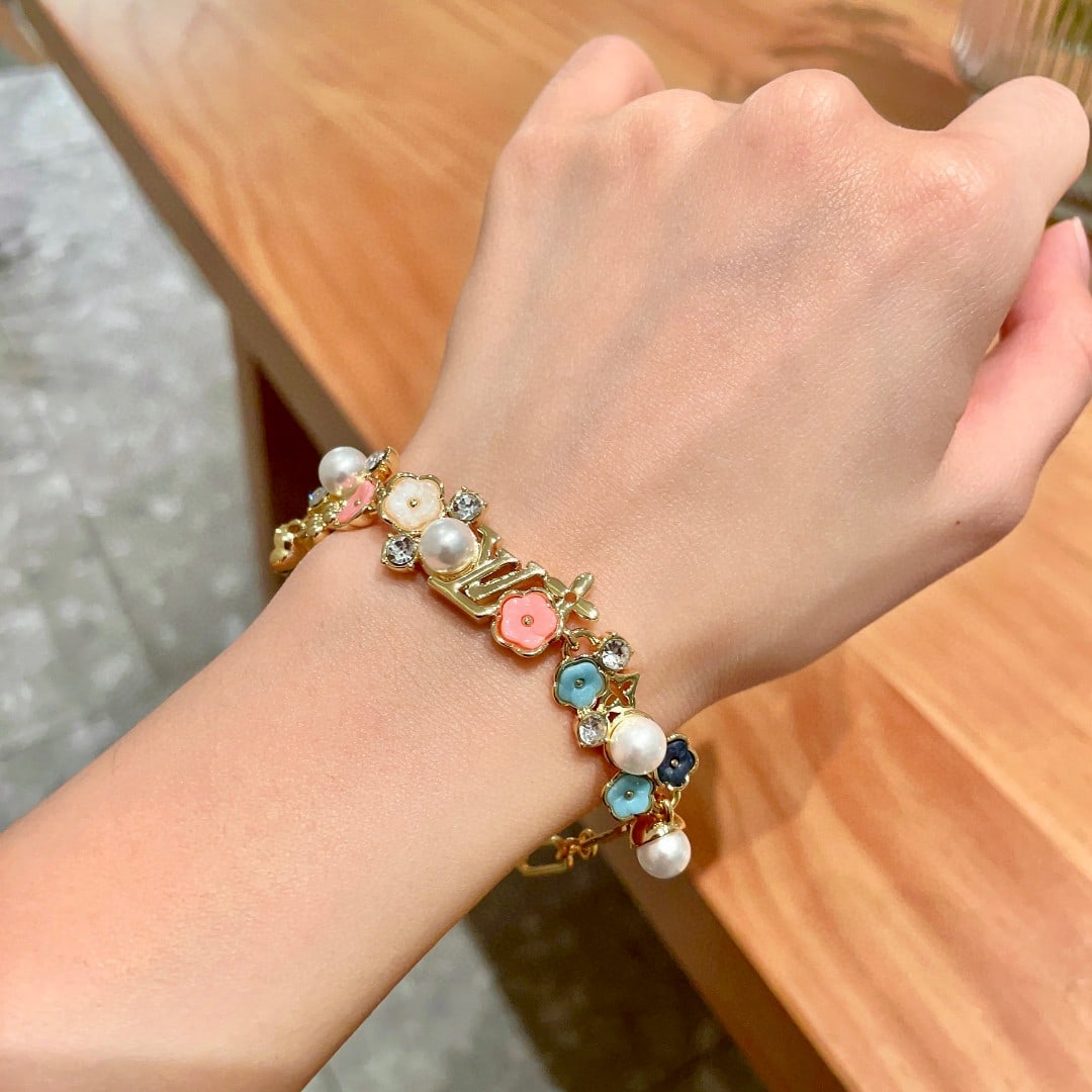 LV: This Louis Vuitton LV (using the iconic LV graphic design) bracelet is beautiful and incredibly versatile; it goes with everything. A wonderful gift for you or your loved one. We offer consoiled shipm