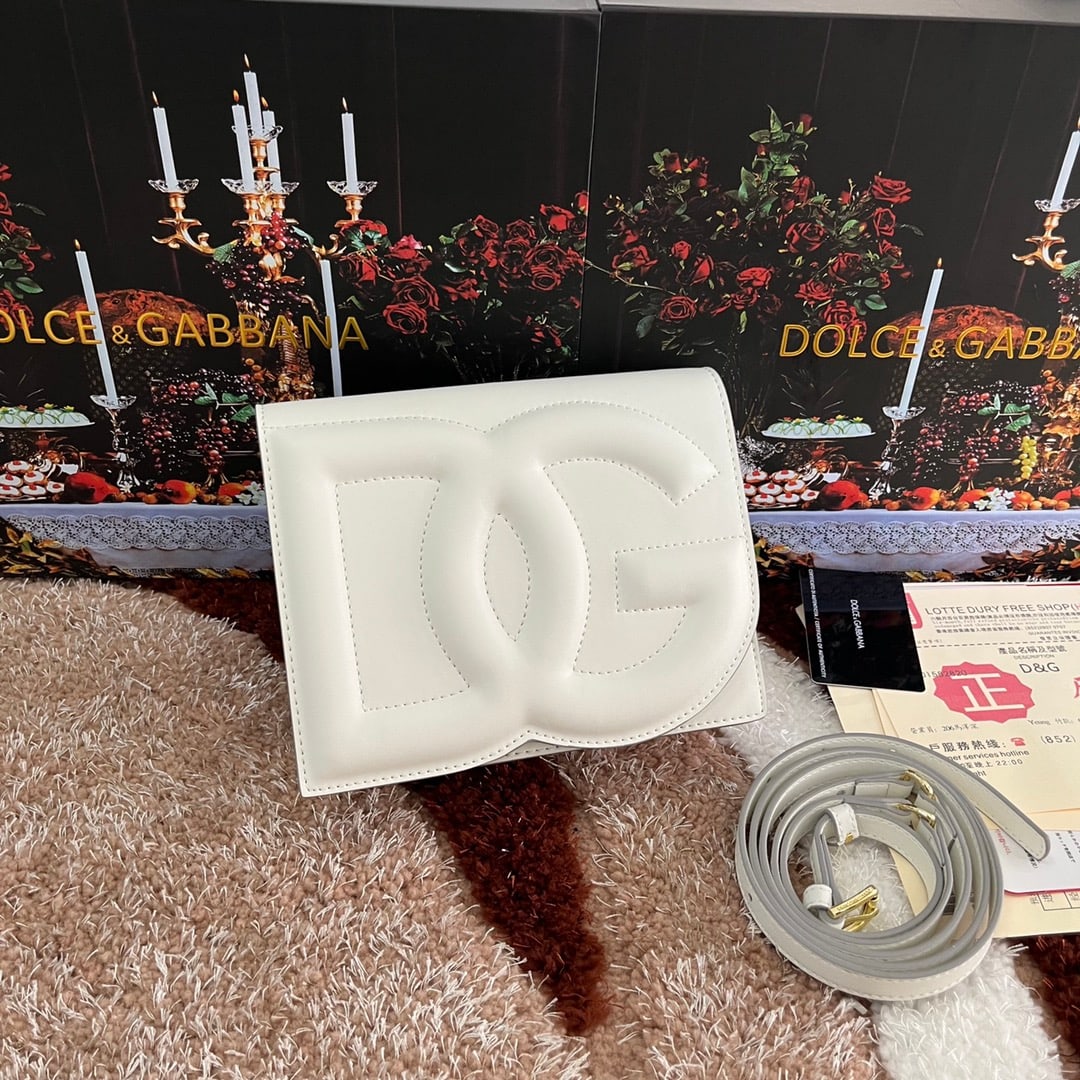 Dolce & Gabbana: Dolce & Gabbana's exquisite handcrafted leather bag features a calfskin body with hand-painted edges for a structured look. The quilted DG logo adds a touch of modern style, making it a favorite among