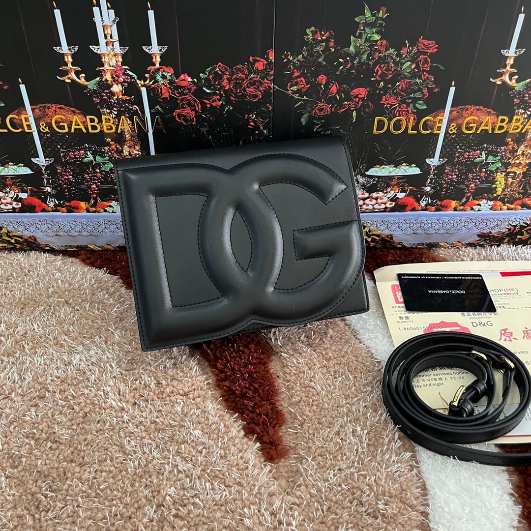 Dolce & Gabbana: Dolce & Gabbana's exquisite handcrafted leather bag features a calfskin body with hand-painted edges for a structured look. The quilted DG logo adds a touch of modern style, making it a favorite among