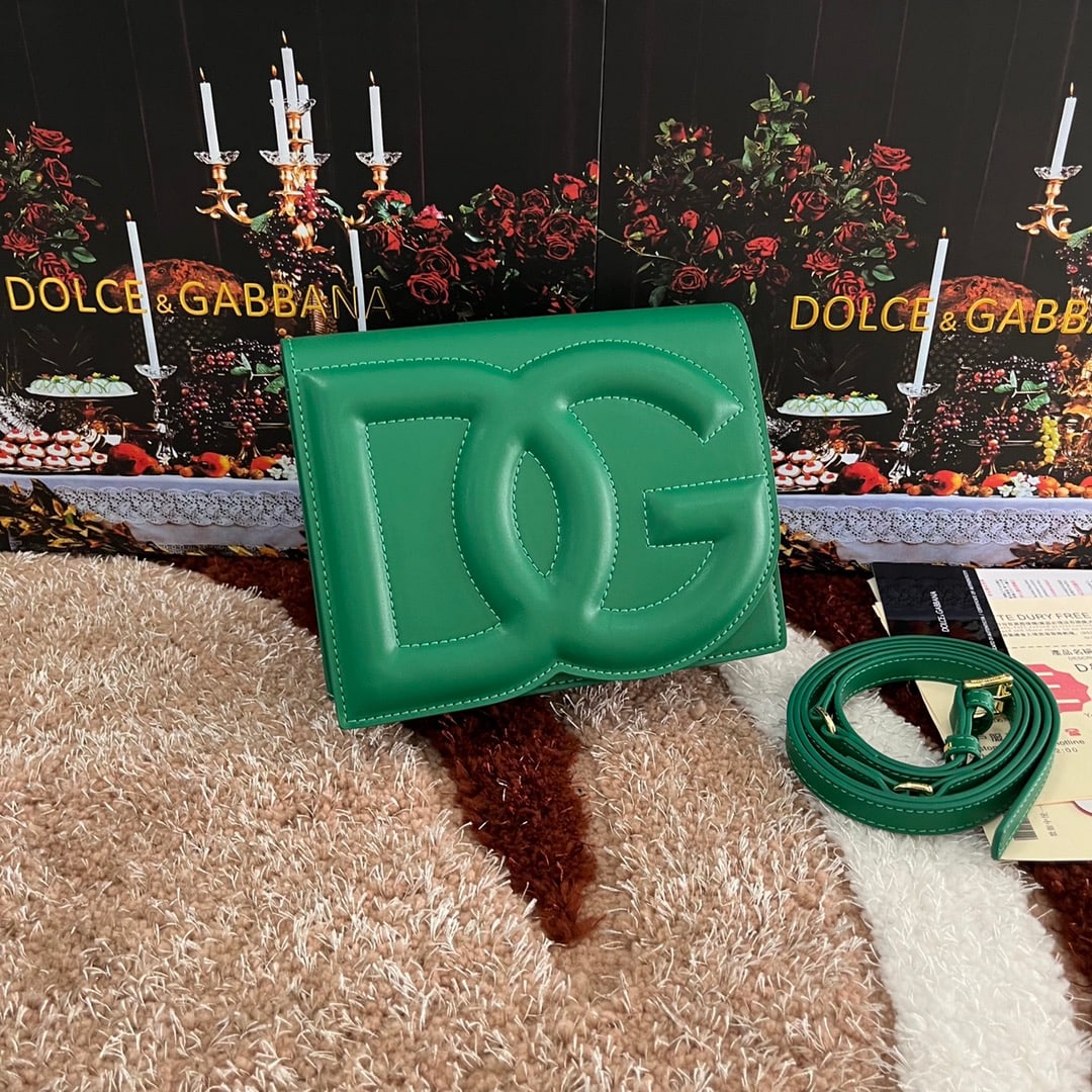 Dolce & Gabbana: Dolce & Gabbana's exquisite handcrafted leather bag features a calfskin body with hand-painted edges for a structured look. The quilted DG logo adds a touch of modern style, making it a favorite among