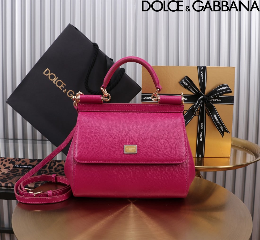 Dolce & Gabbana: The iconic Dolce & Gabbana Sicily is now presented in a compact version, offering easy storage for frequently used items. Its unique design features a hidden magnetic closure on the front flap. Size: 