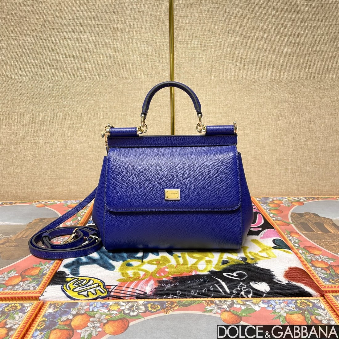Dolce & Gabbana: The iconic Dolce & Gabbana Sicily is now presented in a compact version, offering easy storage for frequently used items. Its unique design features a hidden magnetic closure on the front flap. Size: 