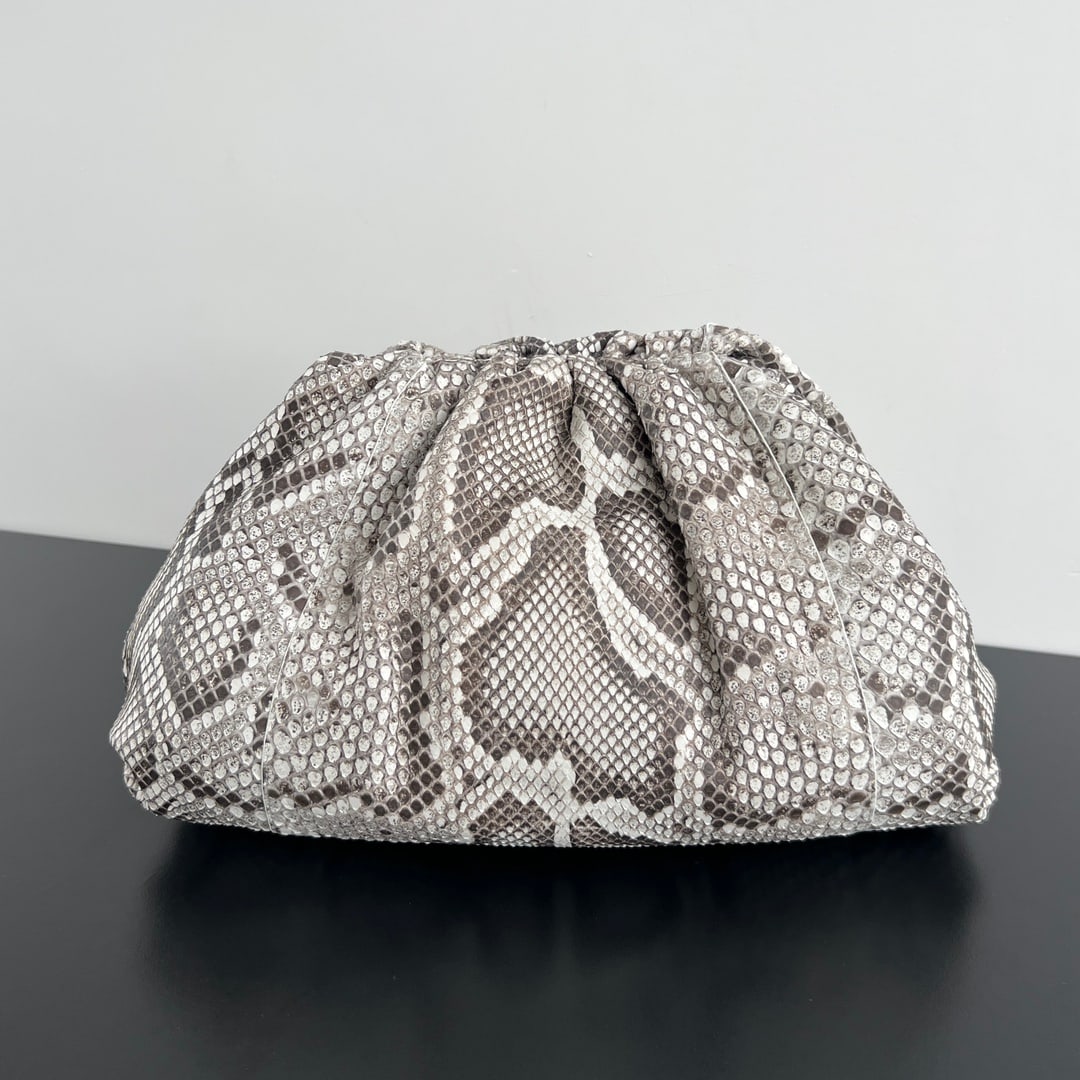 Bottega Veneta Cloud Bag: The Bottega Veneta Cloud Bag is a household name in the fashion world. Made from a single piece of South African python skin, it's a bag only the most affluent women can afford. It exudes a powerful a
