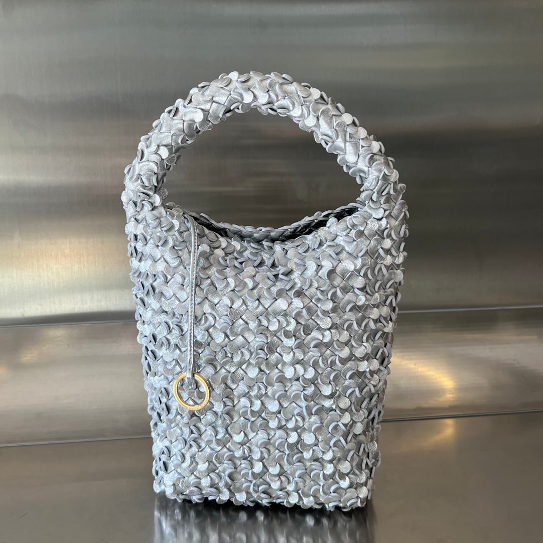 Bottega Veneta Cabat Bucket: The Bottega Veneta Cabat Bucket features a unique three-dimensional design, crafted from individual petals. The meticulous hand-woven petal technique not only elevates the bag's sophistication but als
